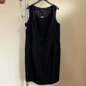 Black dress with front pockets and 14in side zipper